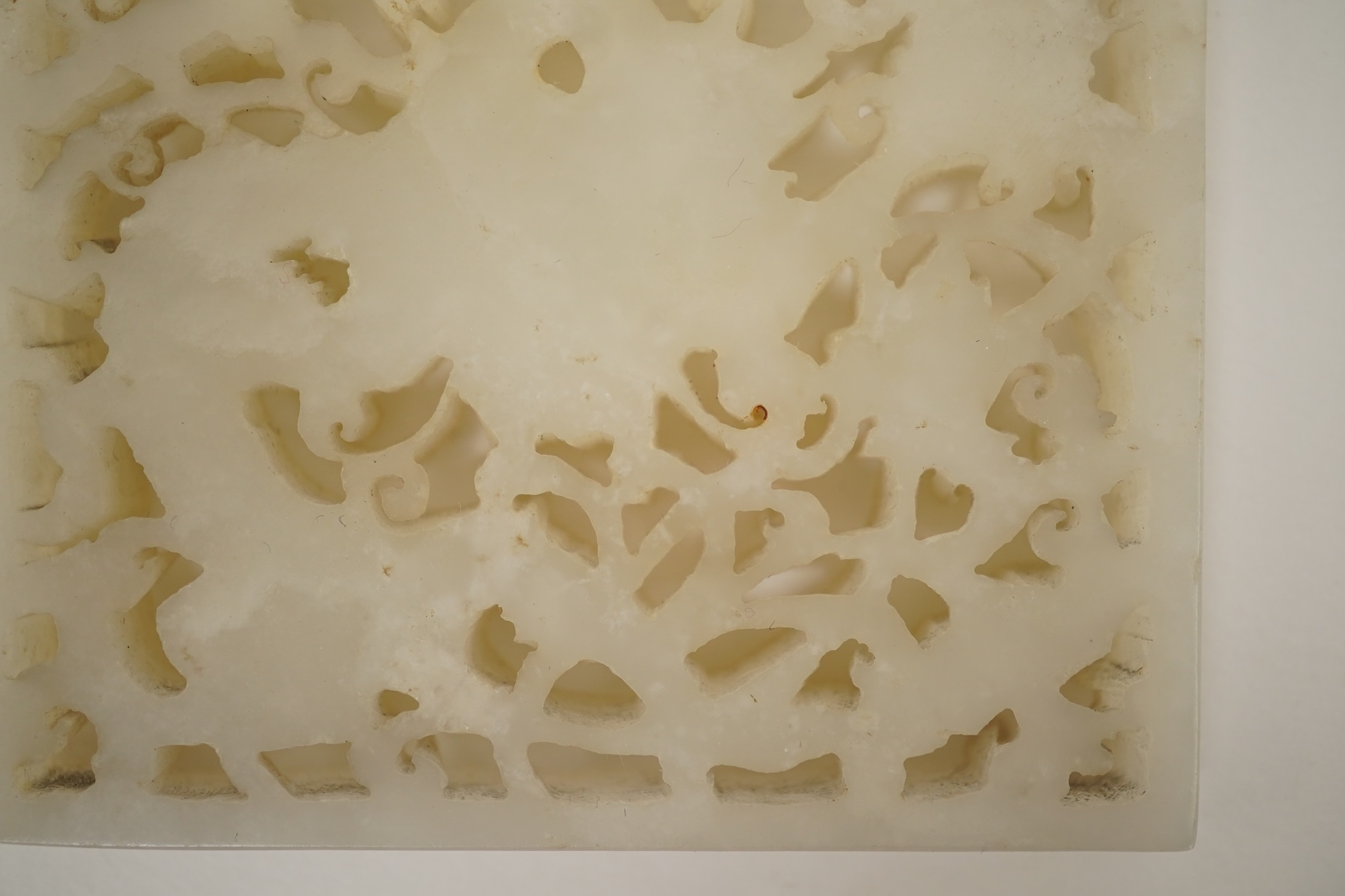 A Chinese reticulated white jade ‘dragon’ plaque, 18th century
